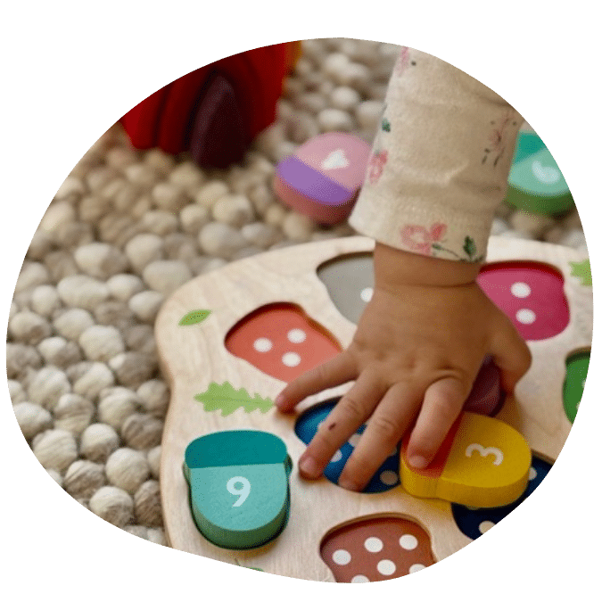 child playing with matching puzzle at Kinderhaus Silicon valley daycare in Mountain View, CA